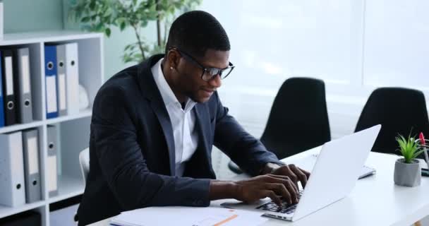 African American Businessman Celebrating Online Success Using Laptop — Stockvideo