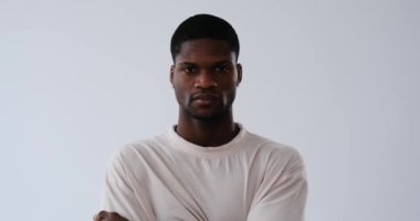 Serious African American young man over white background