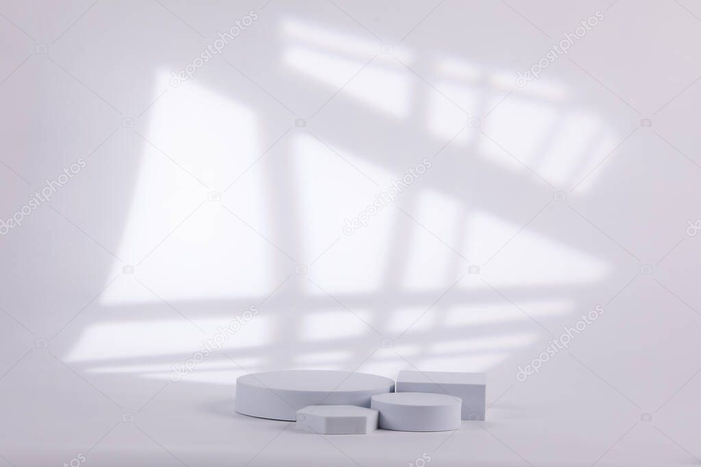 Gray background with a white shape with lines behind for product commercial.