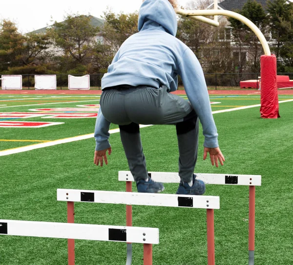 Rear View High School Boy Wearing Blue Hoodie Jumping Track — Foto Stock