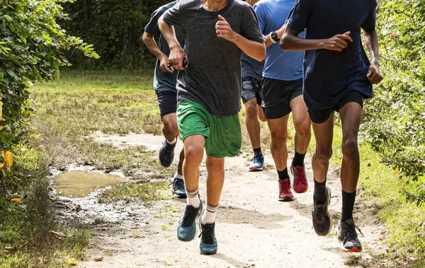 Front View High School Boys Running Together Dirt Path Park — Stock fotografie