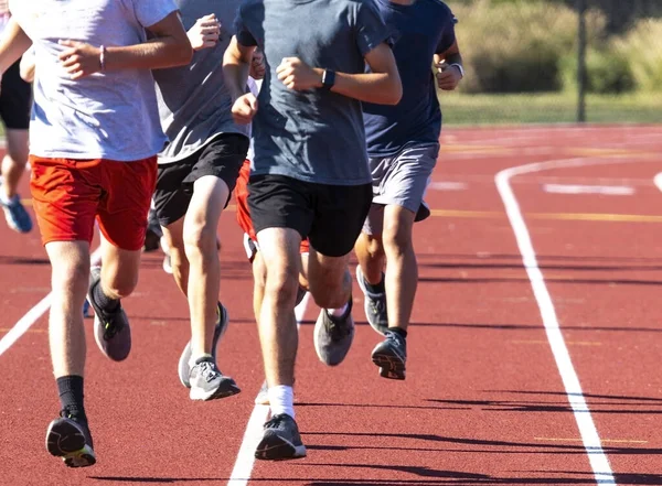 Boys High School Cross Country Team Running Fast Group Red — Fotografia de Stock