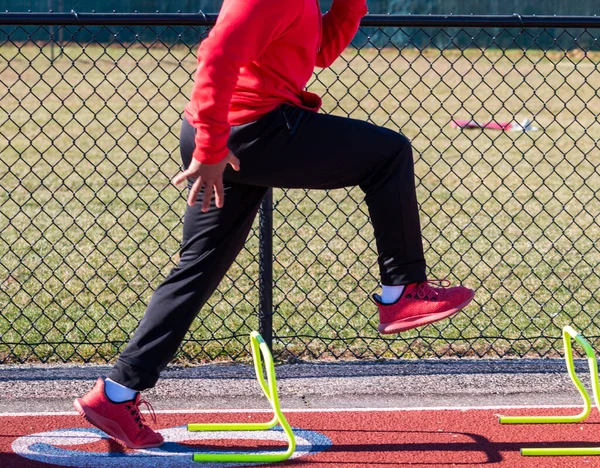 High School Track Runner Standing Yellow Mini Hurdle Position Perfoming — Stock Photo, Image