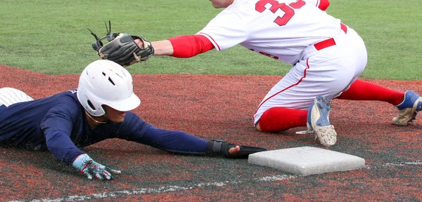 Baseball Player Sliding Head First Third Base Avoiding Tag High — 스톡 사진