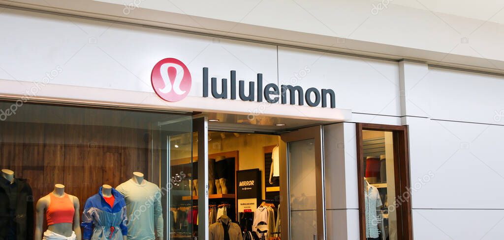 Huntington, New York, USA - 1 May 2022: Looking at the entrance and window display of a lululemon store inside a mall on Long Island.