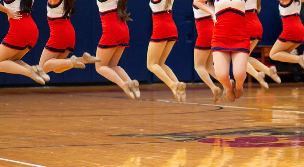 High School Kickline Dancers Air While Performing Half Time Basketball — Stock Fotó