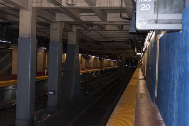 Long Island Railroads Track 20 an underground train track in Penn Station in New York City with no one on it.