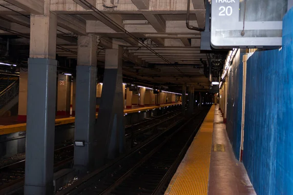 Long Island Railroads Track 20 an underground train track in Penn Station in New York City with no one on it.