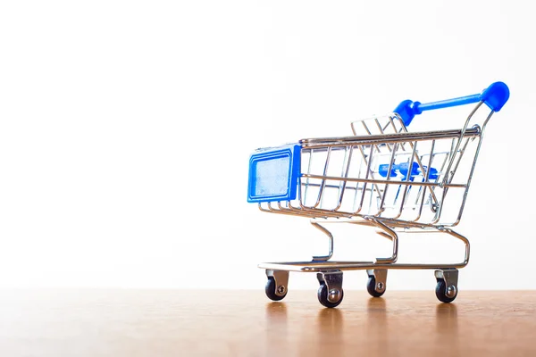Shopping carts on the wooden floor — Stock Photo, Image