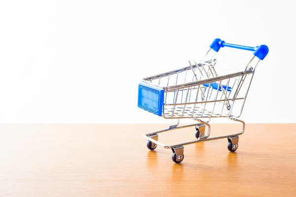 Winkelwagentjes op de houten vloer Stockfoto