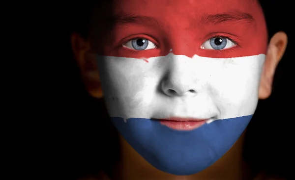 Portret van een kind met een geschilderde Nederland, vlag — Stockfoto