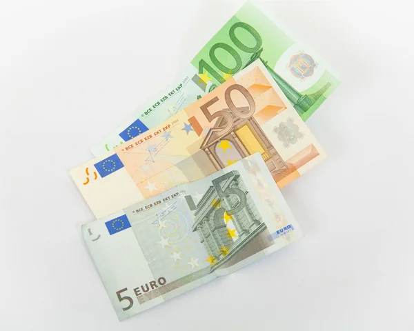 Billetes en euros sobre fondo blanco — Foto de Stock