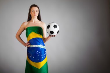 woman in the Brazilian flag and soccer ball clipart