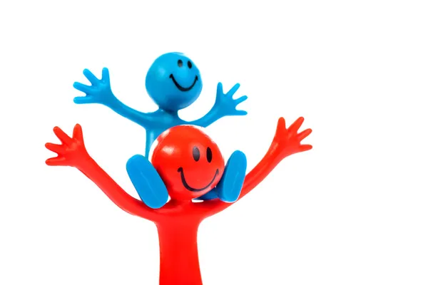Красный улыбающийся человек и голубой сын — стоковое фото