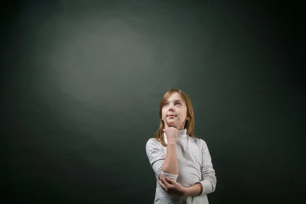 Menina perguntando e olhando para cima — Fotografia de Stock