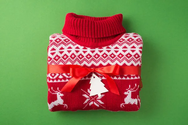 Top View Photo Folded Red White Christmas Sweater Red Ribbon — Stock Photo, Image