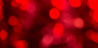 Parlak kırmızı bokeh arkaplanının fotoğrafı