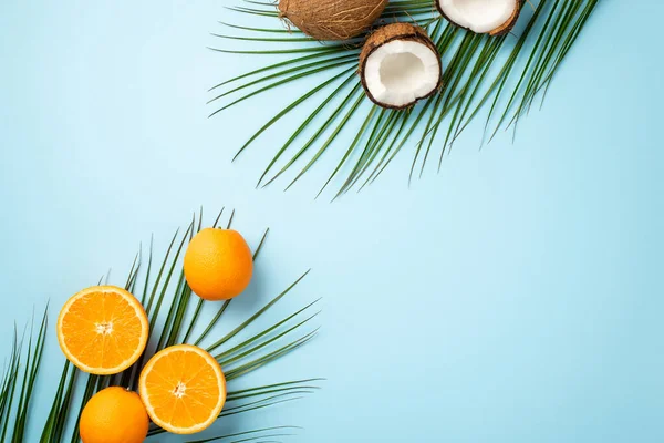 Summer Concept Top View Photo Cracked Coconuts Oranges Palm Leaves — Fotografia de Stock
