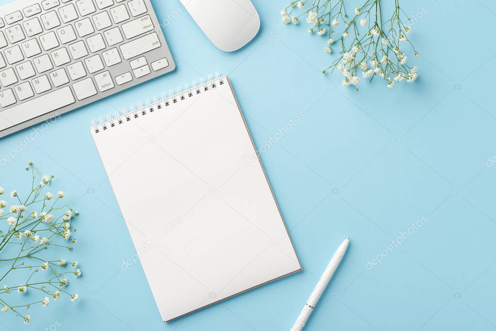 Business concept. Top view photo of workstation keyboard computer mouse open planner pen and white gypsophila flowers on isolated pastel blue background with blank space