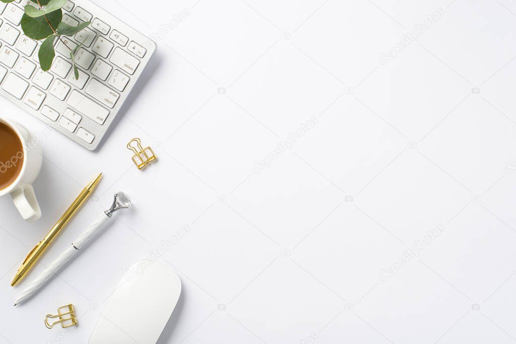 Business concept. Top view photo of workstation keyboard computer mouse eucalyptus cup of coffee gold binder clips and stylish pens on isolated white background with empty space