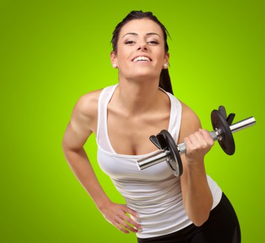 Young woman holding dumbells clipart
