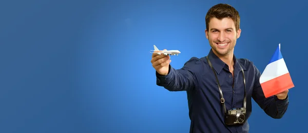 Mann mit Miniaturflugzeug und Frankreich-Fahne — Stockfoto