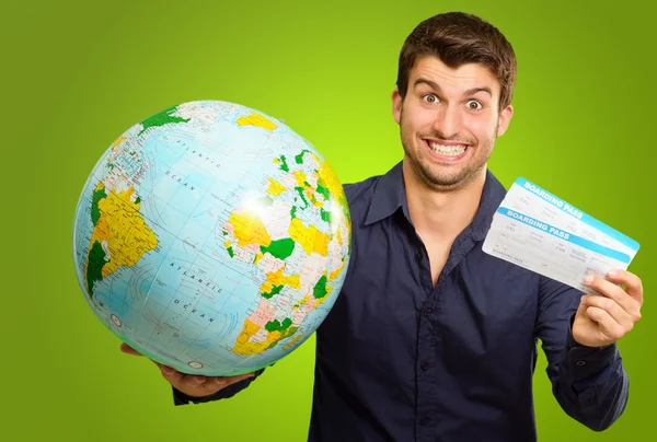 A Young Man Holding Tickets And Globe — Stock Photo, Image