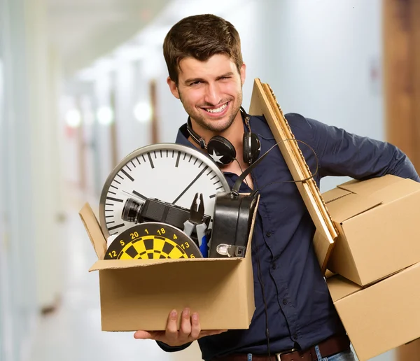 Man Holding Box And Picture Frame — Stock Photo, Image