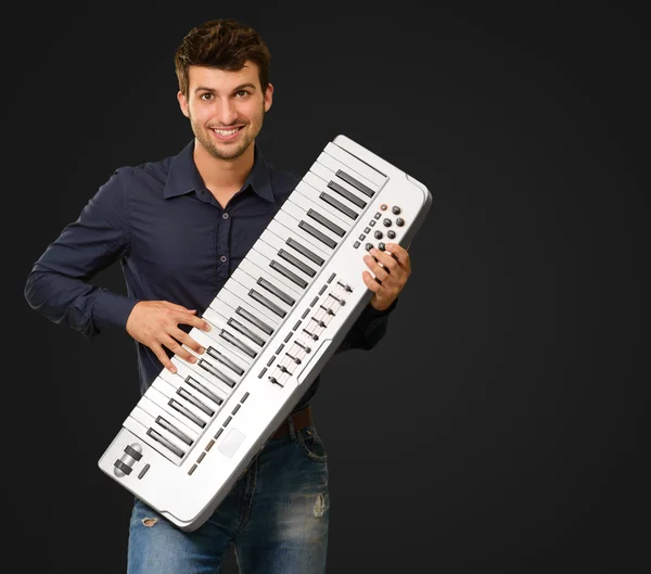 Portrait Of A Man Holding Piano — Stock Photo, Image