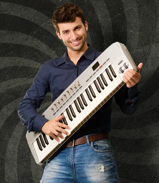 Portrait Of A Man Holding Piano