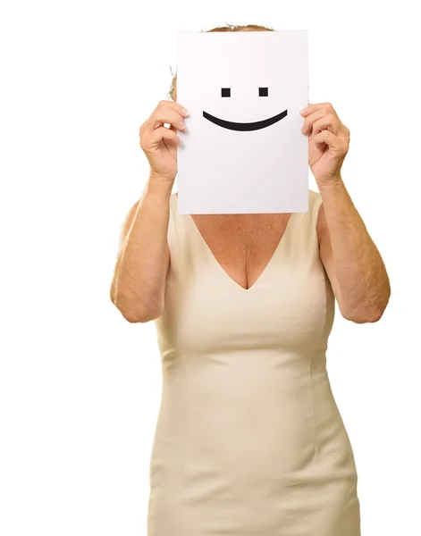 Зріла жінка тримає знак посмішки — стокове фото
