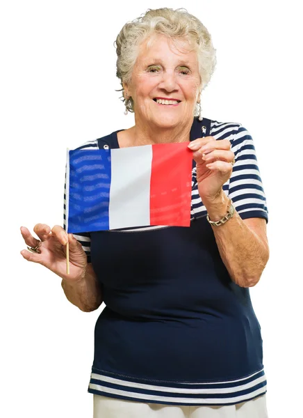 Femme âgée tenant le drapeau de la France — Photo