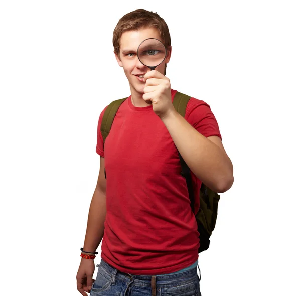 Retrato de um estudante olhando através de lupa — Fotografia de Stock