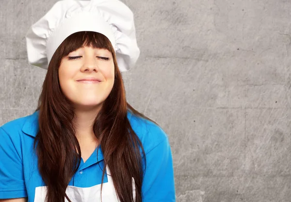 Portrait of a young female chef satisfied — Stock Photo, Image