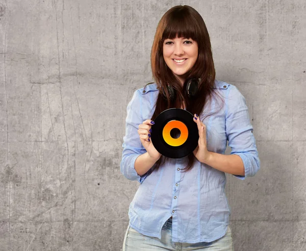 Retrato de una mujer sosteniendo un disco —  Fotos de Stock