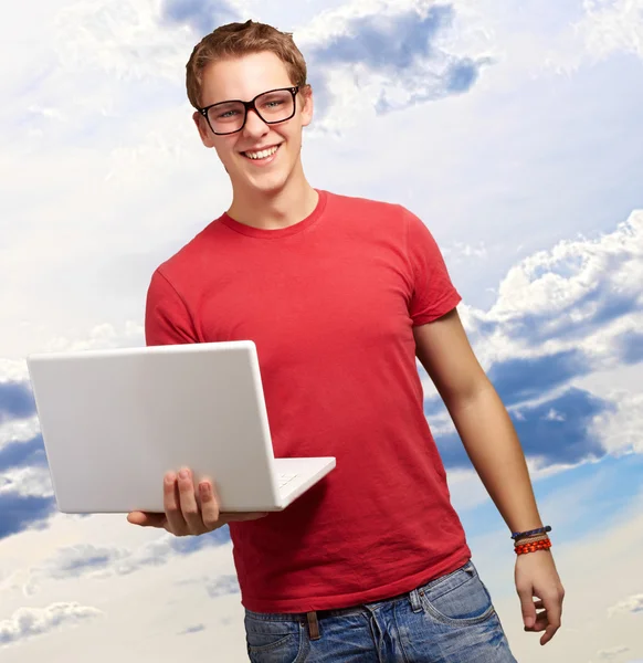 Casual man holding laptop Royalty Free Stock Photos