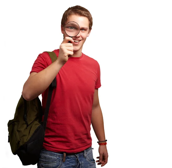 Porträt einer Studentin, die durch die Lupe schaut Stockfoto