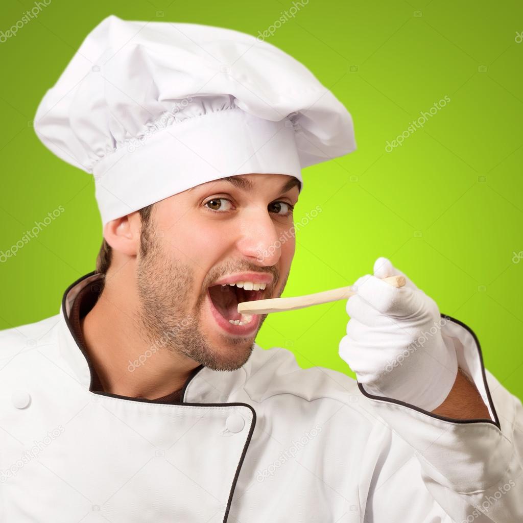 Portrait Of Young Male Chef Holding Spoon