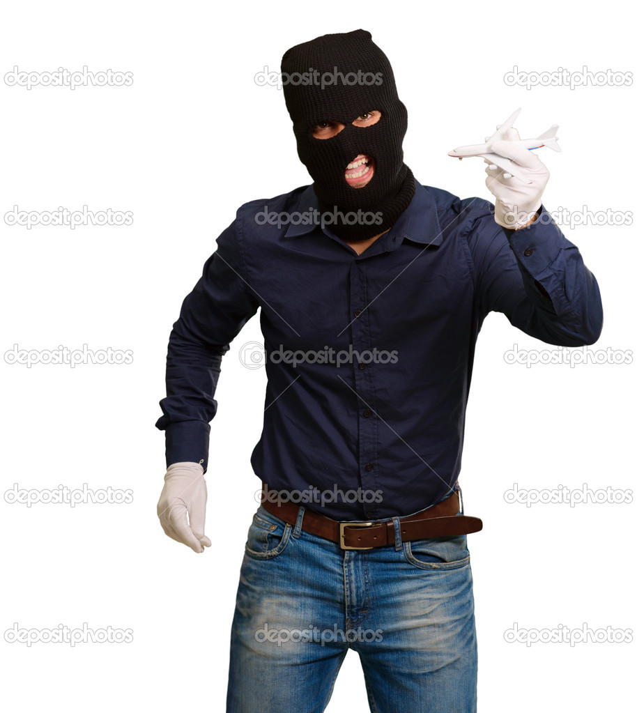 Man wearing robber mask and holding airplane miniature