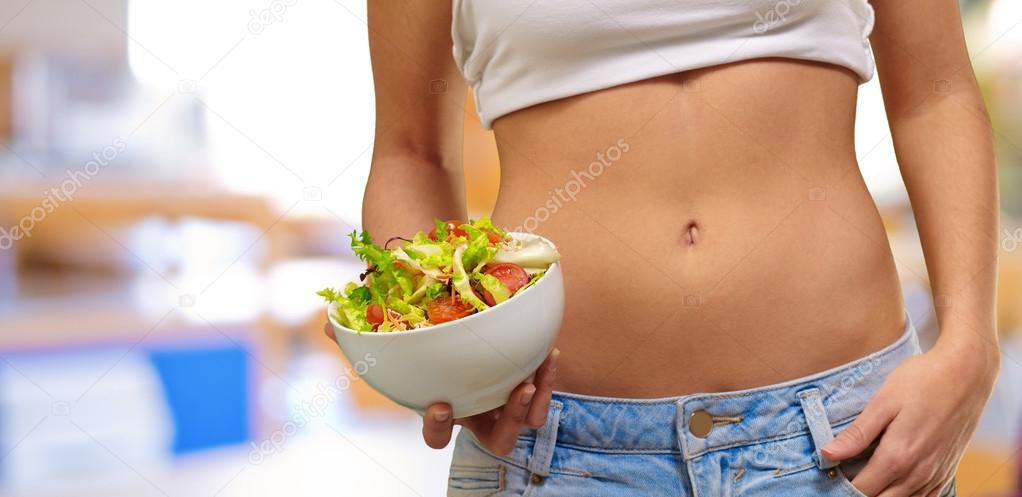 Female Holding A Bowl Of Salad