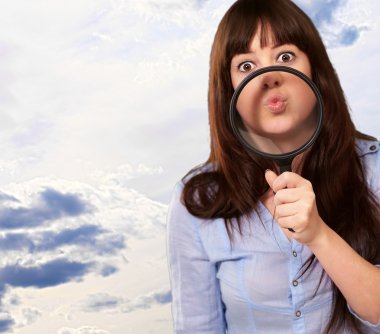 Woman Holding Magnifying Glass On Mouth clipart
