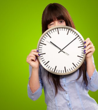 Woman Holding Clock Winking clipart