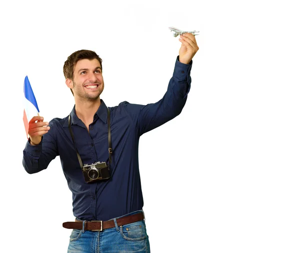 Mann mit Fahne und Miniatur eines Flugzeugs — Stockfoto