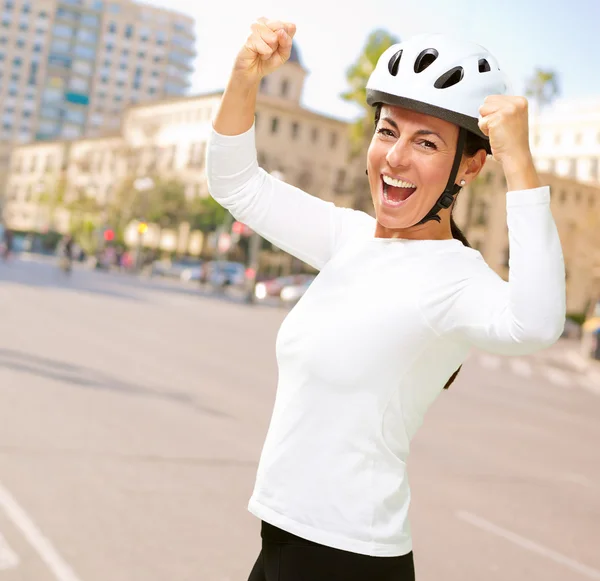 Woman wearing helmet cheering — Stock Photo, Image