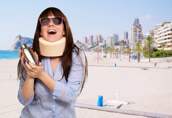 Woman Wearing Neckbrace Holding A Shaker — Stock Photo, Image
