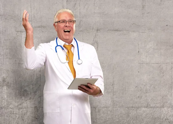Doctor Holding A Tablet And Happy — Stock Photo, Image