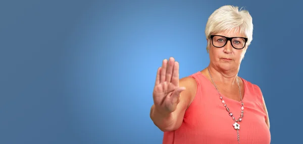 Portrait Of A Senior Woman Showing Stop Sign — Stock Photo, Image