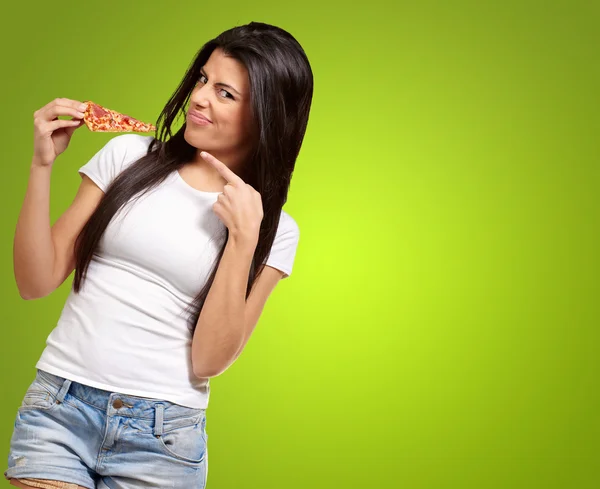 Portrait Of A Young Woman Eating A Piece Of Pizza — Stock Photo, Image