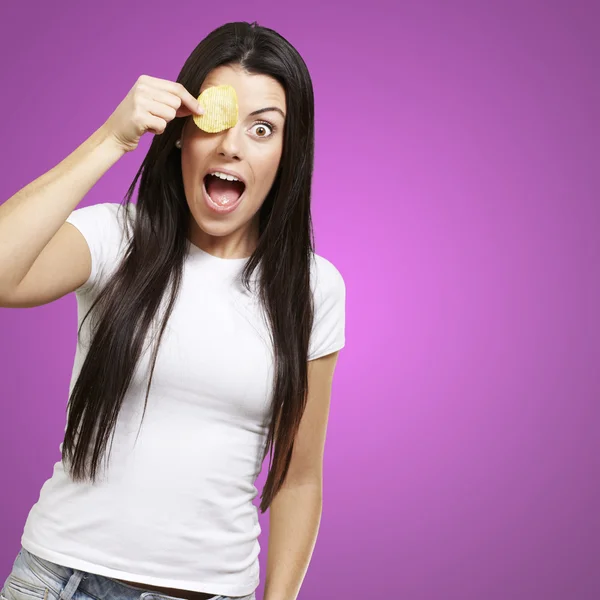 Woman with a potatoe chip — Stock Photo, Image