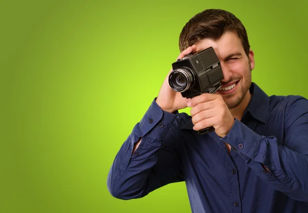 Young Man Holding Old Camera — Stok fotoğraf